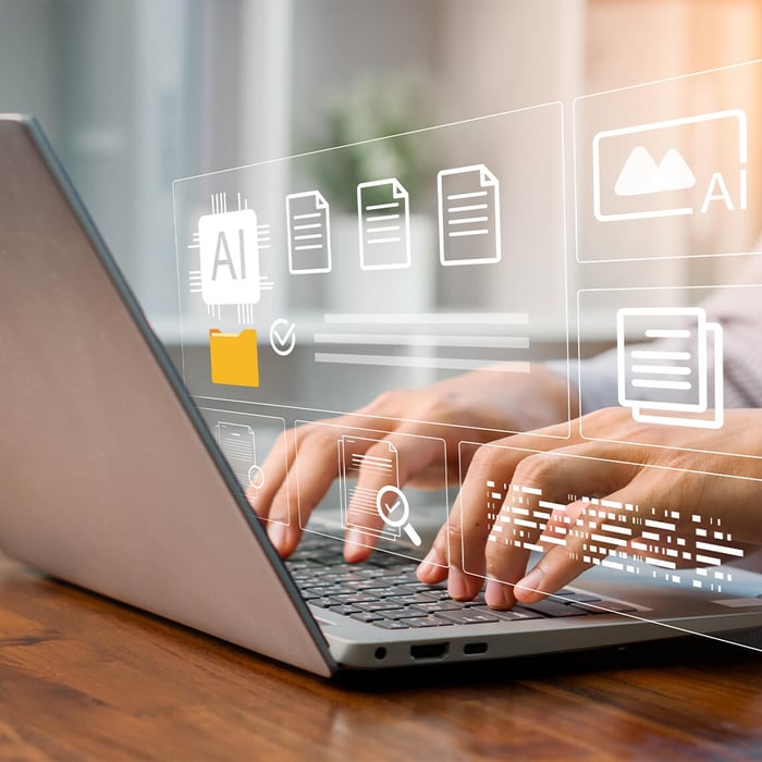Close-up of hands typing on a laptop. Digital overlays show AI icons and document management.