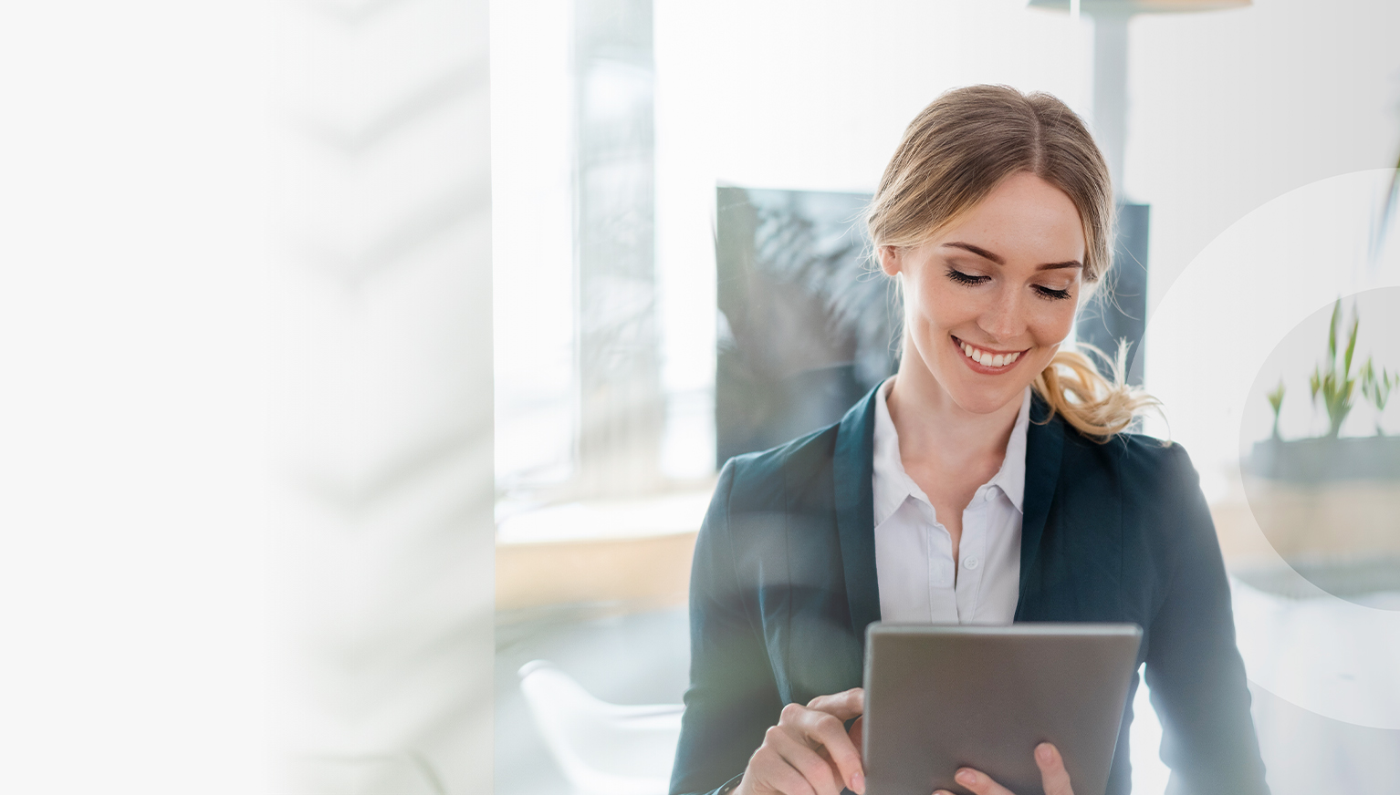 Smiling blonde businesswoman with tablet in bright office. Digital elements float above the tablet.