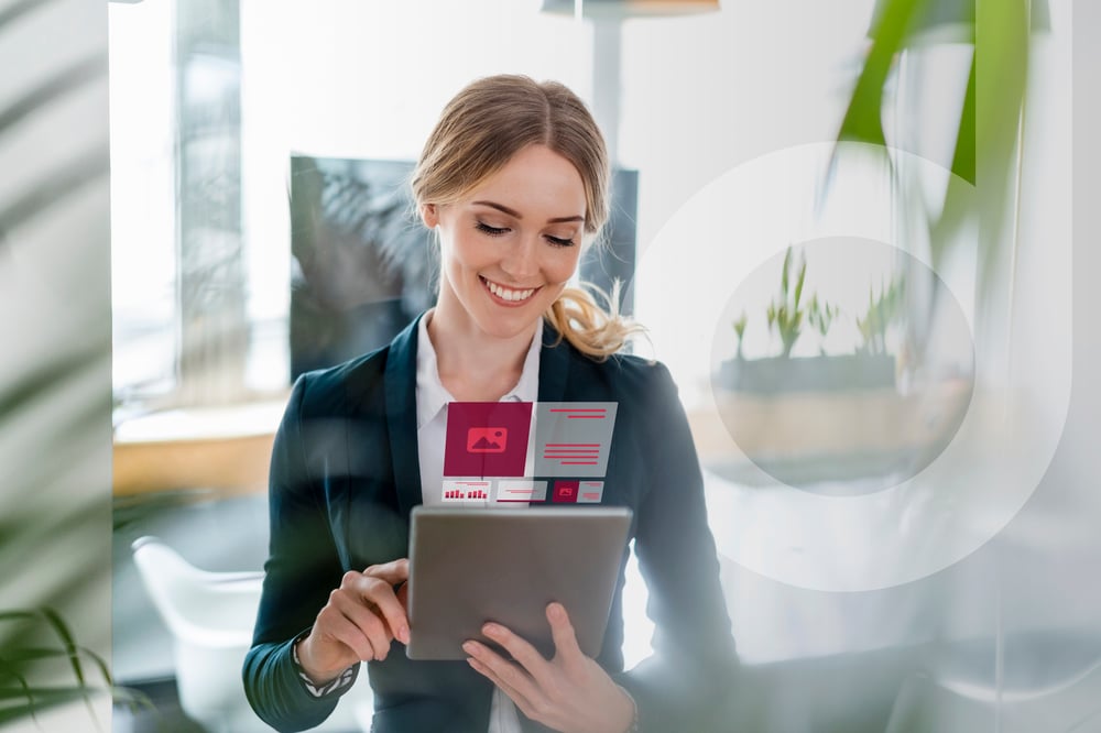 A smiling businesswoman uses a tablet in a modern office. Graphic overlays display digital information.